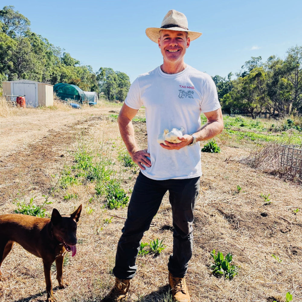 Regenerative Farmer, Quinn, with his Elephant Garlic