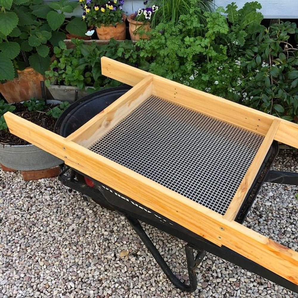 Compost Sieve, Lying Along a Wheelbarrow