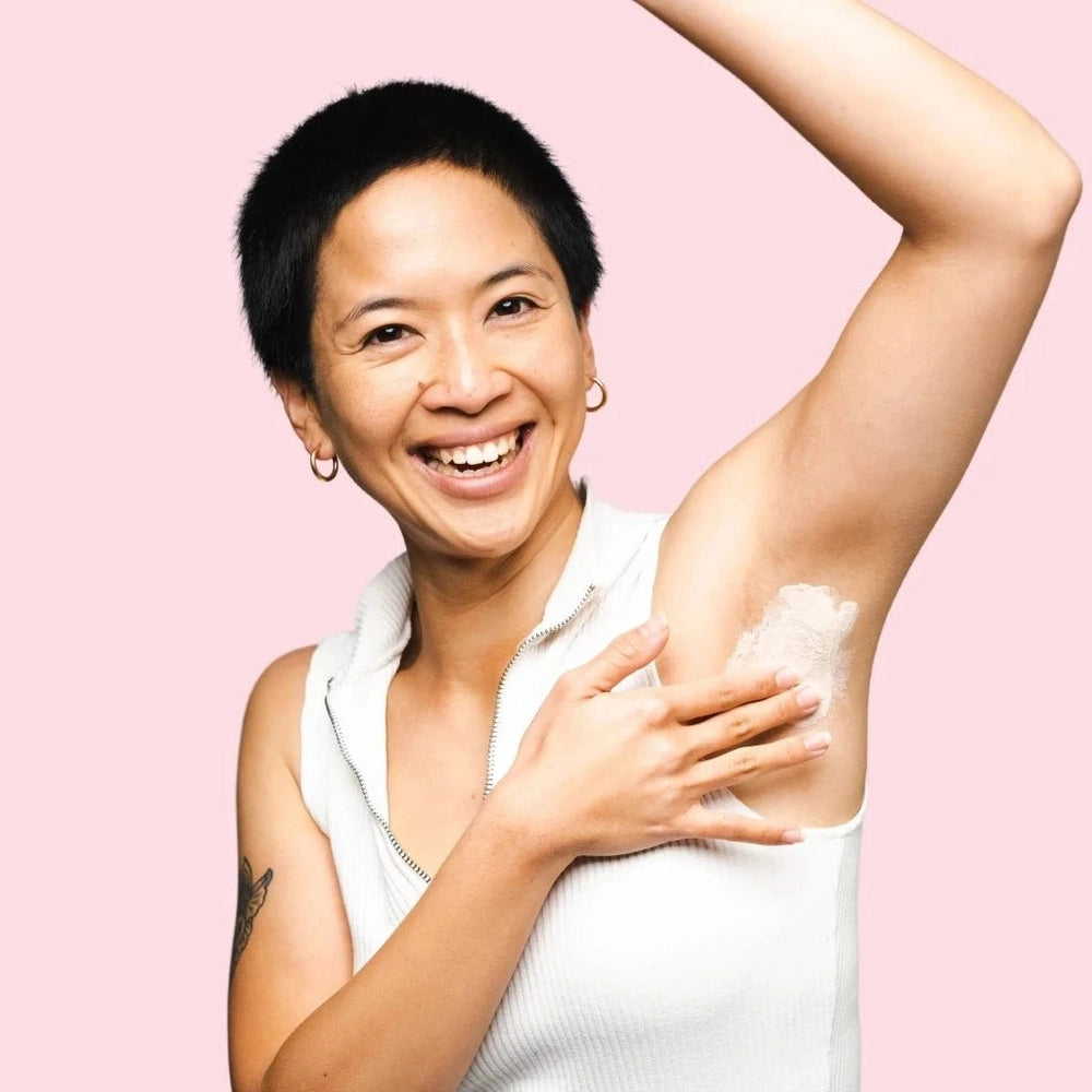 Woman applying Woohoo Armpit Detox Mask.